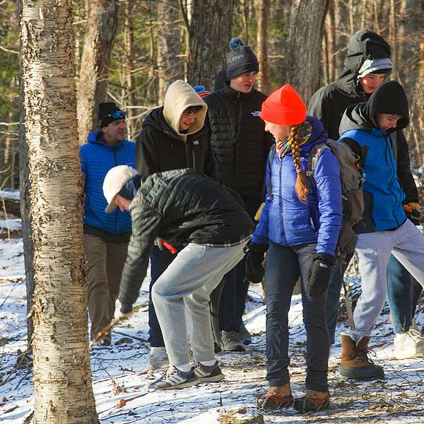 Carolyn and Stowe High School students use various tools to clear out the Rime Line trail for winter use.